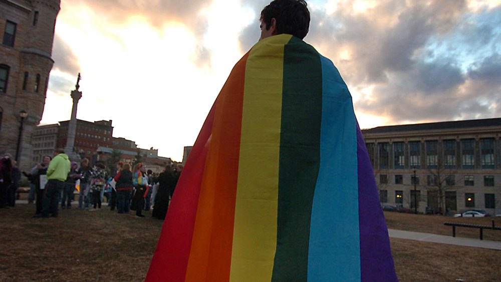 Daniel Wales, 21, of Clarks Summit, Pa. wears a Pride flag as a cape during a Scranton Candlelight Vigil for Marriage Equality in advance of the Supreme Court DOMA  (AP Photo/The Scranton Times-Tribune, Butch Comegys)