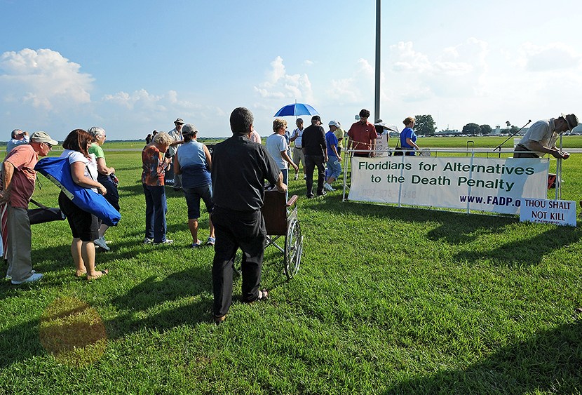 Protesters to the death penalty gather across the highway from the Florida State Correctional facility near Starke, Florida, Monday, Aug. 5, 2013.  (Photo by Phil Sandlin/AP)