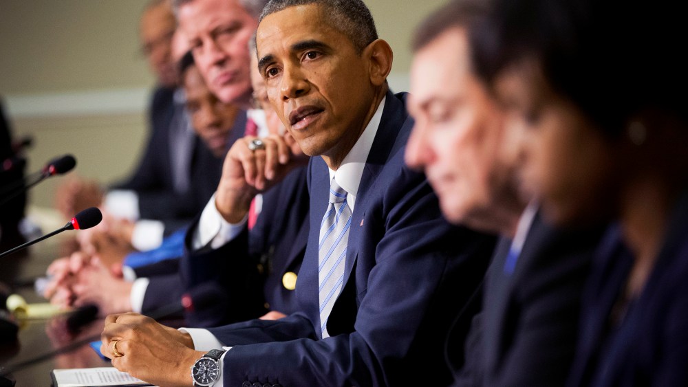 President Barack Obama, center, speaks during his meeting with elected officials, law enforcement officials and community and faith leaders in Washington, D.C., Dec. 1, 2014. (Photo by Pablo Martinez Monsivais/AP)