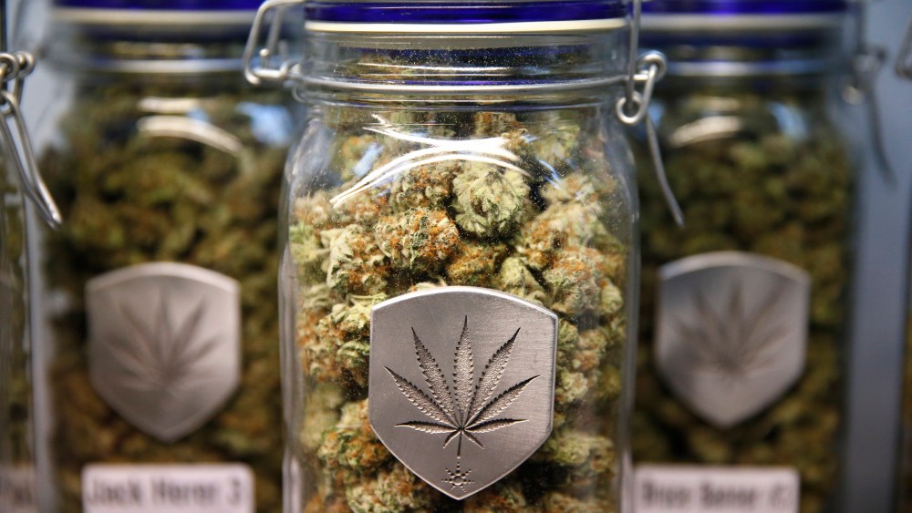 Different strains of pot are displayed for sale at Medicine Man marijuana dispensary in Denver, Friday Dec. 27, 2013.