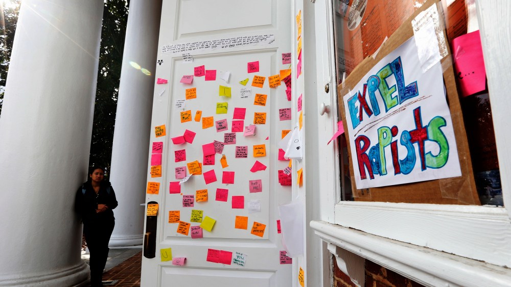 Postings on the door of Peabody Hall related to the Phi Kappa Psi gang rape allegations at the University of Virginia in Charlottesville, Va., Nov. 24, 2014. (Photo by Steve Helber/AP)