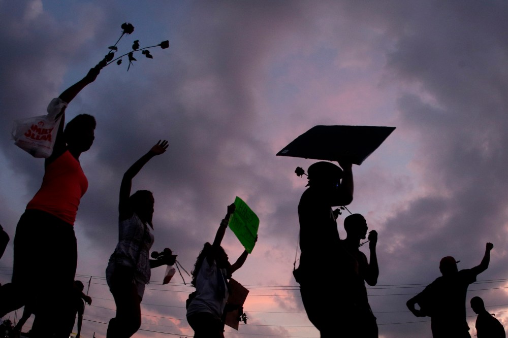 People protest the death of Michael Brown on Aug. 18, 2014 in Ferguson Mo., for Michael Brown, who was killed by a police officer Aug. 9 in Ferguson, Mo.
