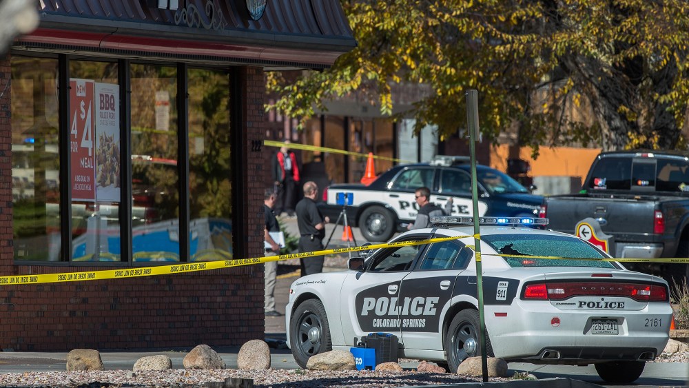 The rear window of a Colorado Springs Police car is shattered after a shooting on Oct. 31, 2015. Multiple are dead, including a suspected gunman, following a shooting spree according to authorities. (Photo by Christian Murdock/The Gazette/AP)