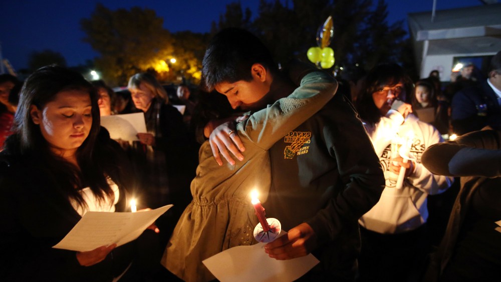 Hundreds of students and residents attend a candlelight vigil at Sparks Middle School in Sparks, Nev., on Wednesday, Oct. 23, 2013,
