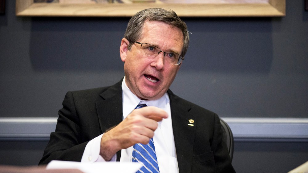 Sen. Mark Kirk, R-Ill., speaks with Roll Call at his desk in the Hart Senate Office Building on Nov. 13, 2014. (Photo By Bill Clark/CQ Roll Call/AP)