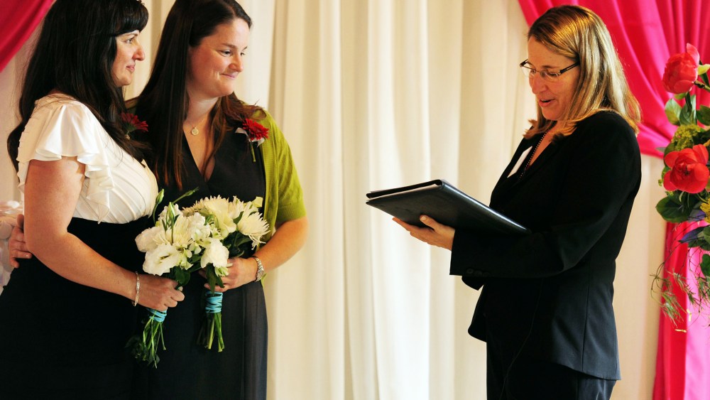 Julia Fraser, left, and Jessica Rohrbacher get married in Portland, Ore., May 19, 2014.