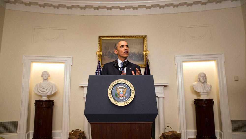 President Barack Obama speaks about the Paris climate agreement from the Cabinet Room of the White House in Washington, Dec. 12, 2015. (Photo by Jacquelyn Martin/AP)