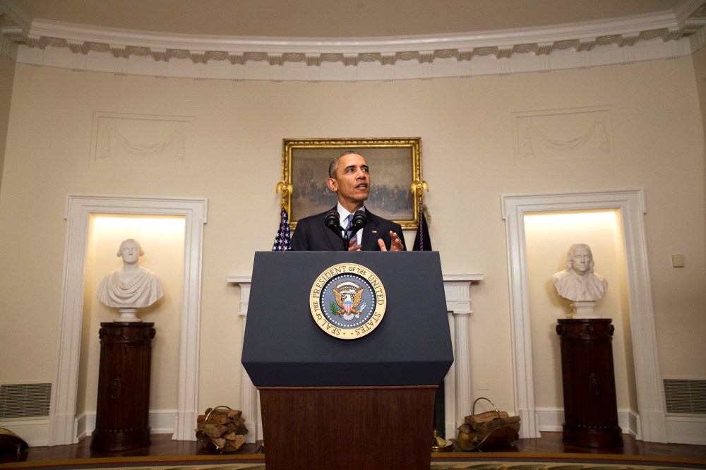 President Barack Obama speaks about the Paris climate agreement from the Cabinet Room of the White House in Washington, Dec. 12, 2015. (Photo by Jacquelyn Martin/AP)