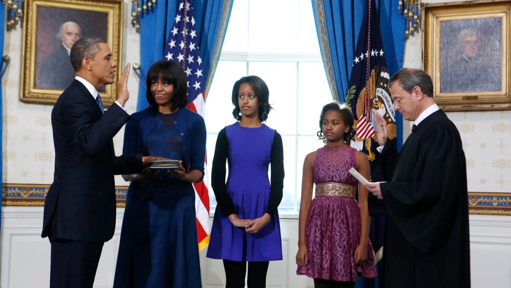 President Barack Obama is officially sworn-in by Chief Justice John Roberts in the Blue Room of the White House during the 57th Presidential Inauguration in Washington, Sunday Jan. 20, 2013. Next to Obama are first lady Michelle Obama, holding the...