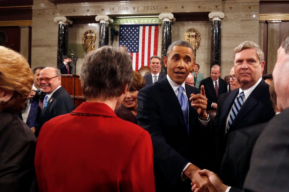 Barack Obama shakes hands after giving the State of Union address, Jan. 28, 2014.