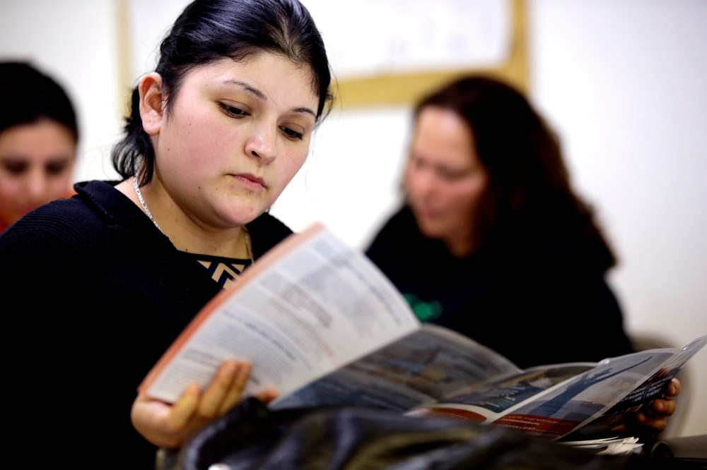 Sara Rodriguez looks over an Affordable Care Act brochure, in Houston on March 11, 2014.