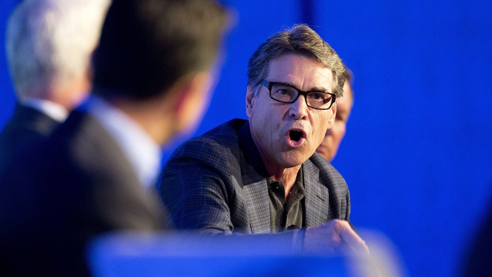 Texas Gov. Rick Perry talks about the costs of illegal immigration in his state during a press conference at the Republican governors conference in Boca Raton, Fla., Nov. 19, 2014. (Photo by J Pat Carter/AP)