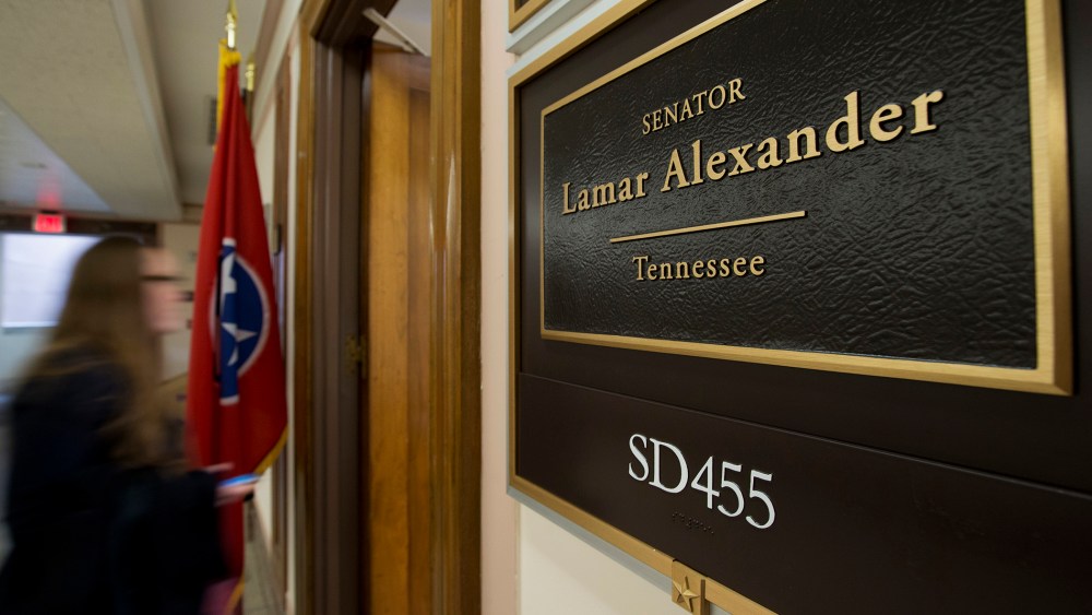 A person walks near the office of Sen. Lamar Alexander, R-Tenn. on Capitol Hill in Washington, Wednesday, Dec. 11, 2013.