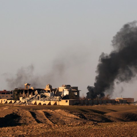Smoke rises from central Tikrit during clashes between Iraqi security forces and Islamic State group extremists in Tikrit, 130 kilometers (80 miles) north of Baghdad, Iraq, March 26, 2015. (Photo by Khalid Mohammed/AP)