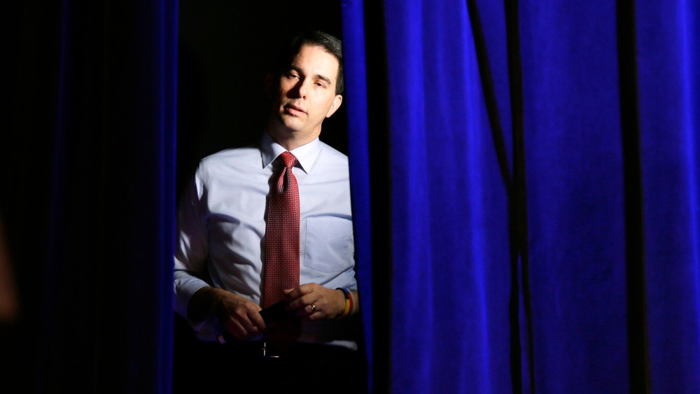 Wisconsin Gov. Scott Walker waits backstage before speaking at the Freedom Summit, Jan. 24, 2015, in Des Moines, Iowa. (Photo by Charlie Neibergall/AP