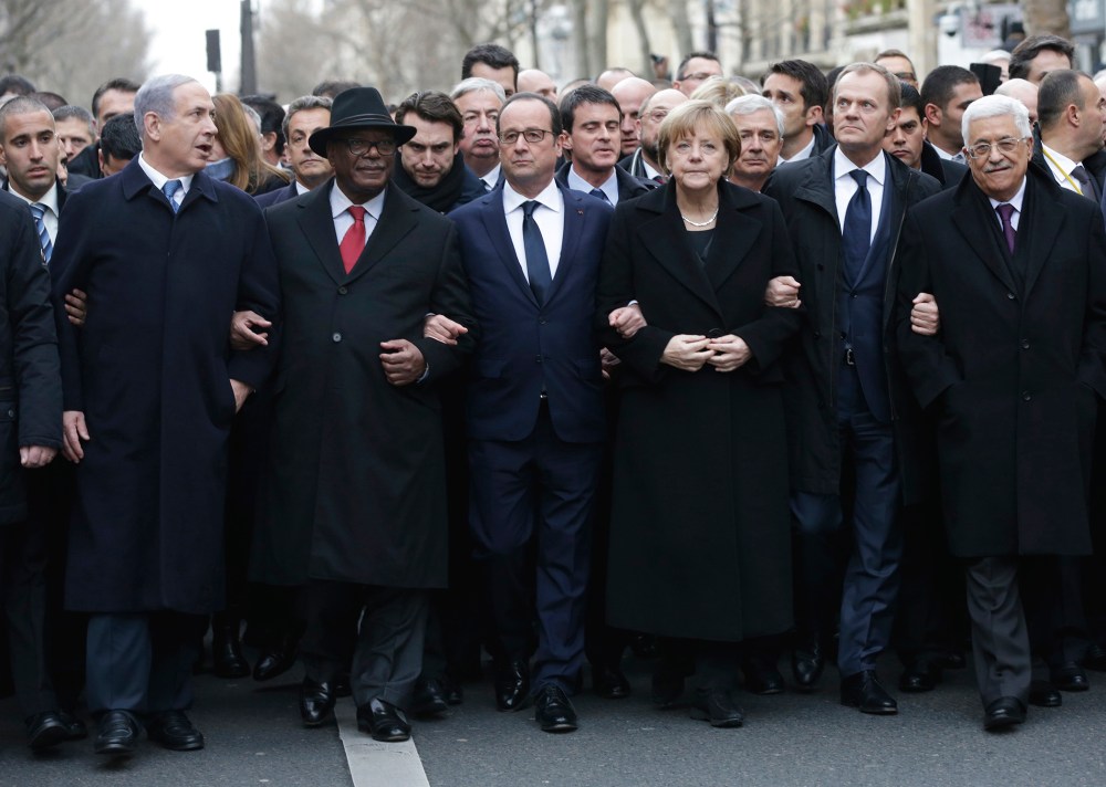 From the left, Israeli Prime Minister Benjamin Netanyahu, Malian President Ibrahim Boubacar Keita, French President Francois Hollande, German Chancellor Angela Merkel, EU president Donald Tusk and Palestinian Authority President Mahmoud Abbas march during