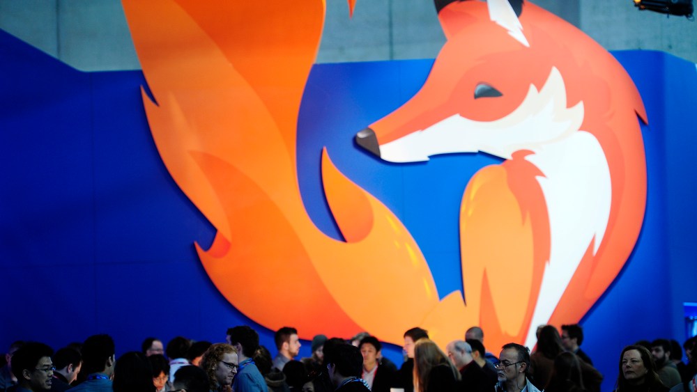 People gather in the Firefox booth at the Mobile World Congress, the world's largest mobile phone trade show in Barcelona, Spain, Feb. 27, 2014.