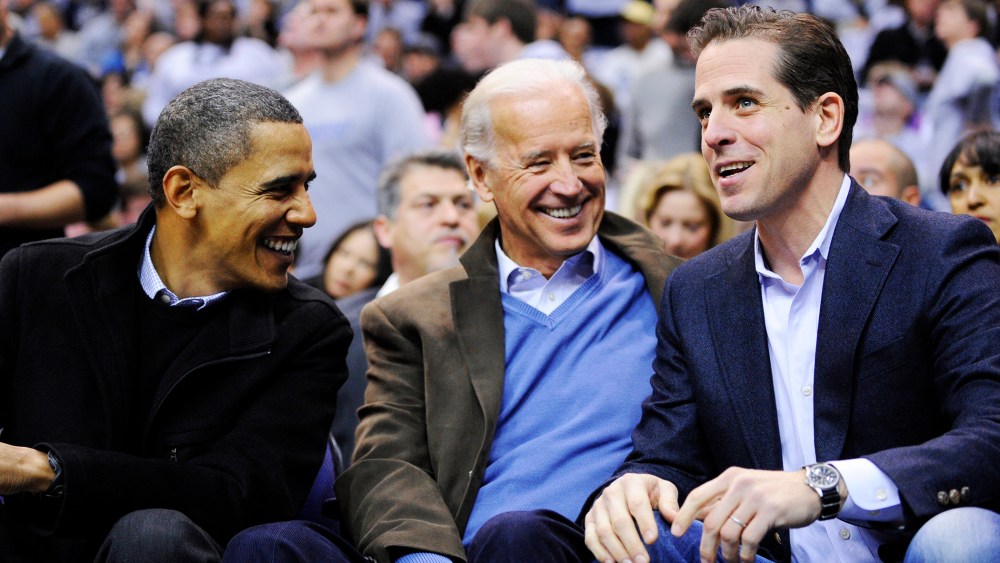 Hunter Biden, right, son of Vice President Joe Biden, center, talking with President Barack Obama during a college basketball game in Washington, D.C. on Jan. 30, 2010.