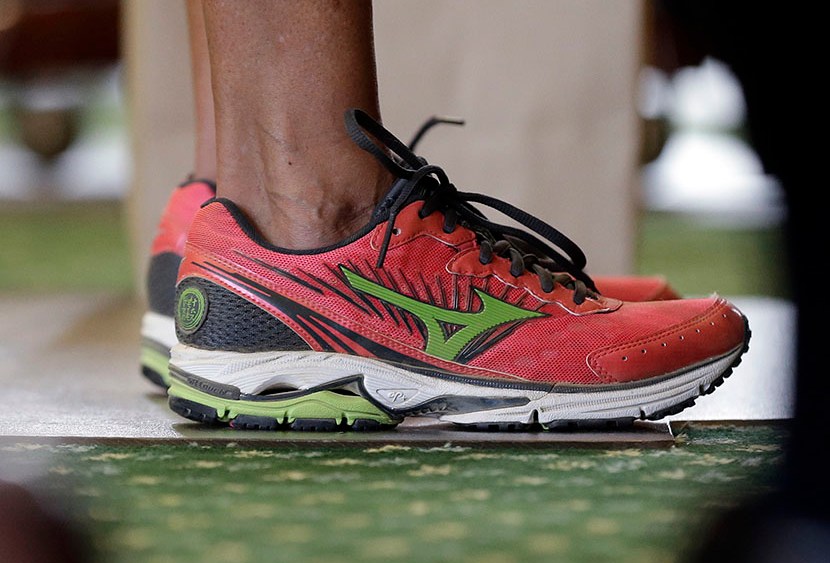 Sen. Wendy Davis, D-Fort Worth, wears tennis shoes in place of her dress shoes as she begins a one-woman filibuster in an effort to kill an abortion bill, Tuesday, June 25, 2013, in Austin, Texas. (Photo by Eric Gay/AP)