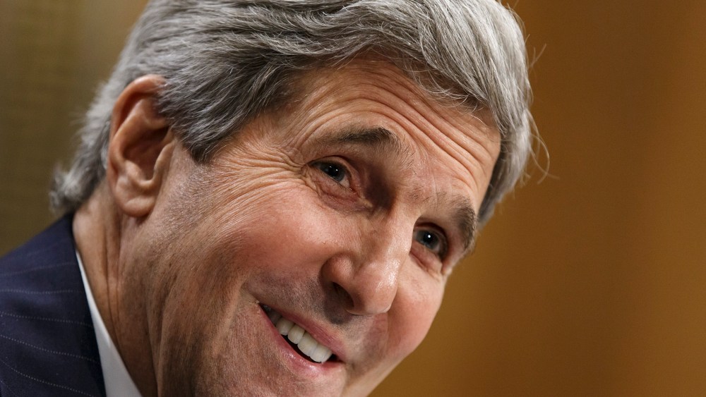 Secretary of State John Kerry smiles as he testifies on Capitol Hill in Washington, April 8, 2014.