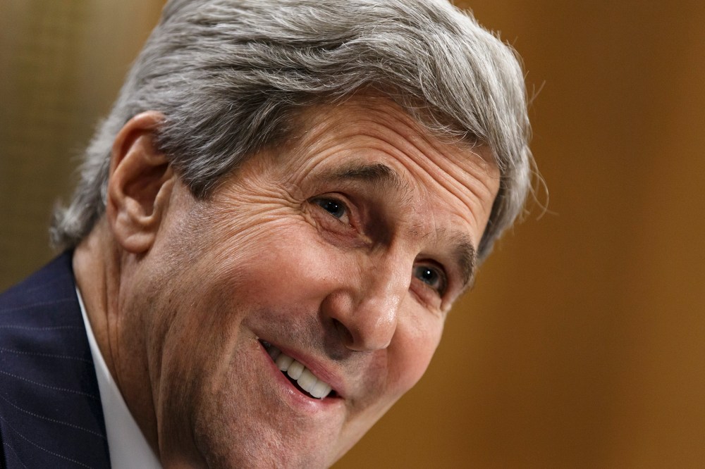 Secretary of State John Kerry smiles as he testifies on Capitol Hill in Washington, April 8, 2014.