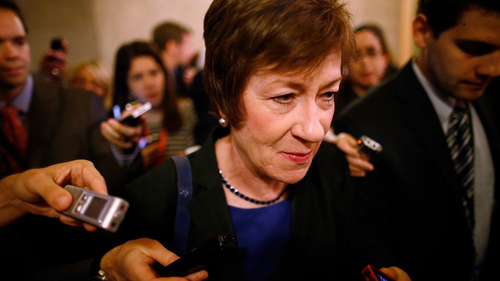 Sen. Susan Collins, R-Maine, is followed by reporters as she leaves a meeting of Senate Republicans regarding the government shutdown and debt ceiling on Capitol Hill in Washington on Saturday, Oct. 12, 2013.