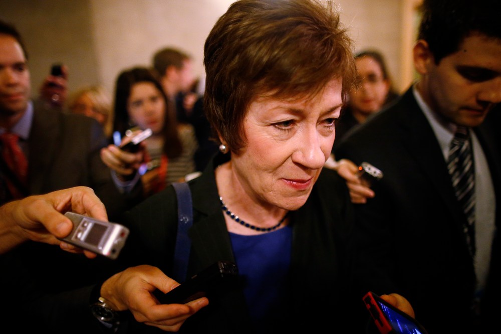 Sen. Susan Collins, R-Maine, is followed by reporters as she leaves a meeting of Senate Republicans regarding the government shutdown and debt ceiling on Capitol Hill in Washington on Saturday, Oct. 12, 2013.