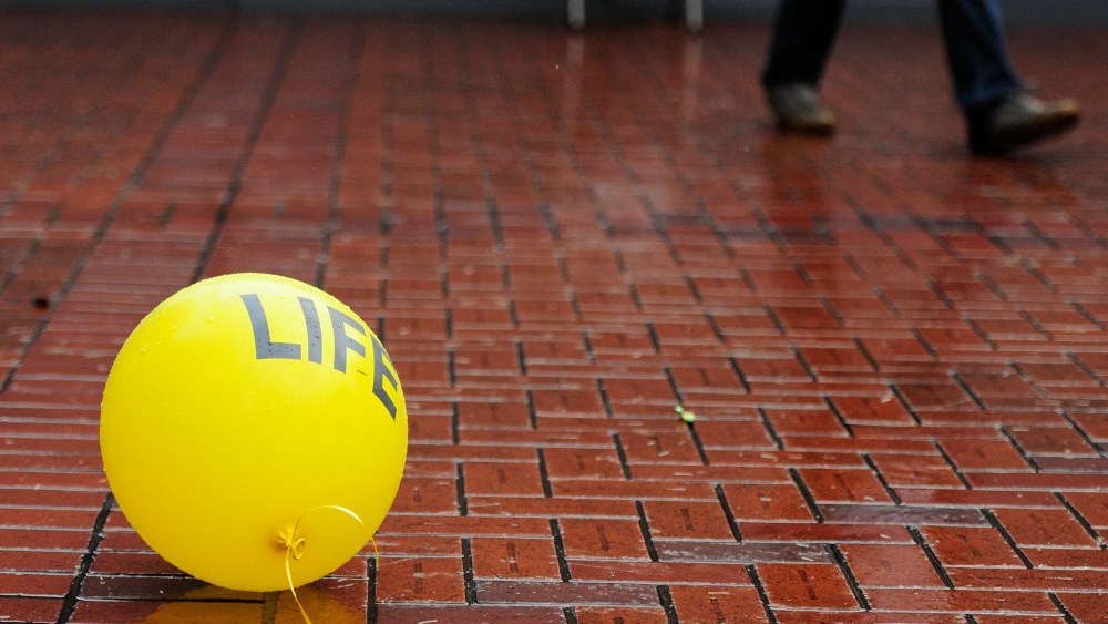 Anti-abortionists rally in Pioneer Courthouse Square in Portland, Ore., on Jan. 18, 2015, to protest against the 1973 Supreme Court decision, Roe v. Wade, that abolished state laws banning abortion. (Photo by Alex Milan Tracy/AP)