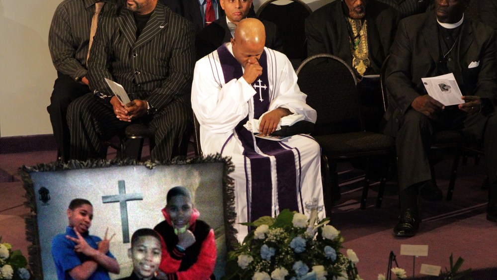 Pastor Henry Currie of Mary B. Wise Baptist Church collects himself during services for Tamir Rice, in Willoughby, Ohio, Dec. 3, 2014. (Photo by The Plain Dealer, Lynn Ischay/AP)