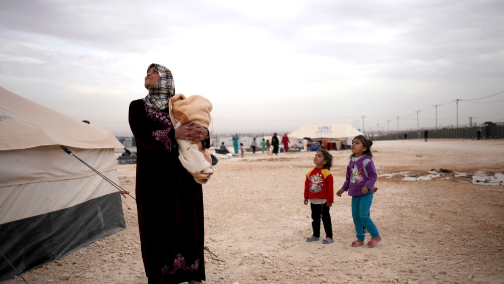 A Syrian mother and her daughters in Zaatari refugee camp, near the Syrian border, in Mafraq, Jordan, on Dec. 3, 2013.