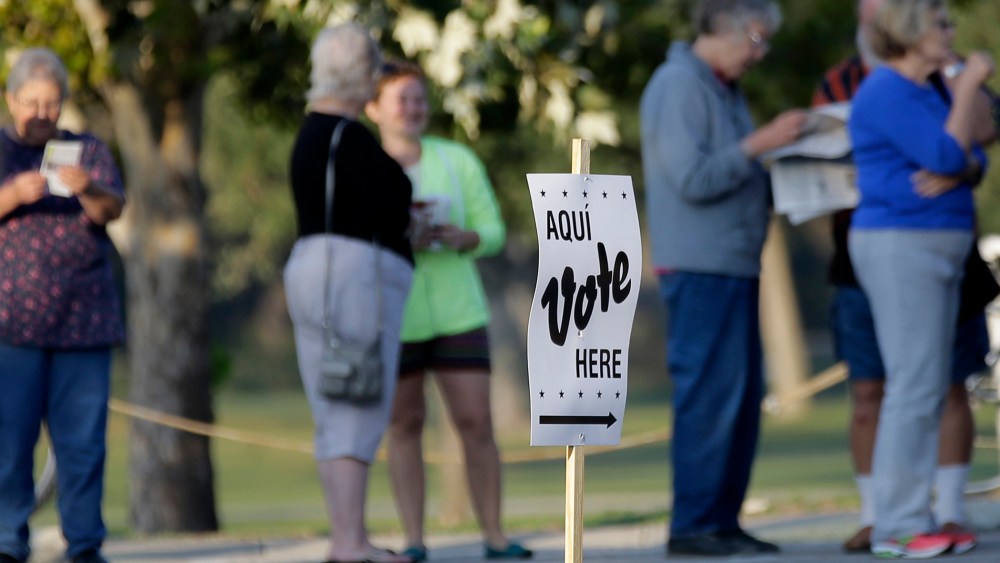Voters stand in line to vote at an early voting polling site on Oct. 20, 2014, in San Antonio, Texas.