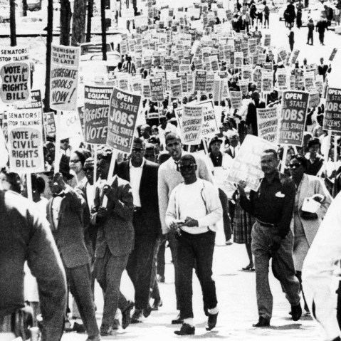 Marchers near the Florida State Capitol carrying signs urging passage of the Civil Rights in Congress on March 27, 1964 in Tallahassee, Fla.