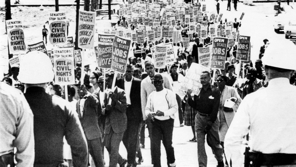 Marchers near the Florida State Capitol carrying signs urging passage of the Civil Rights in Congress on March 27, 1964 in Tallahassee, Fla.