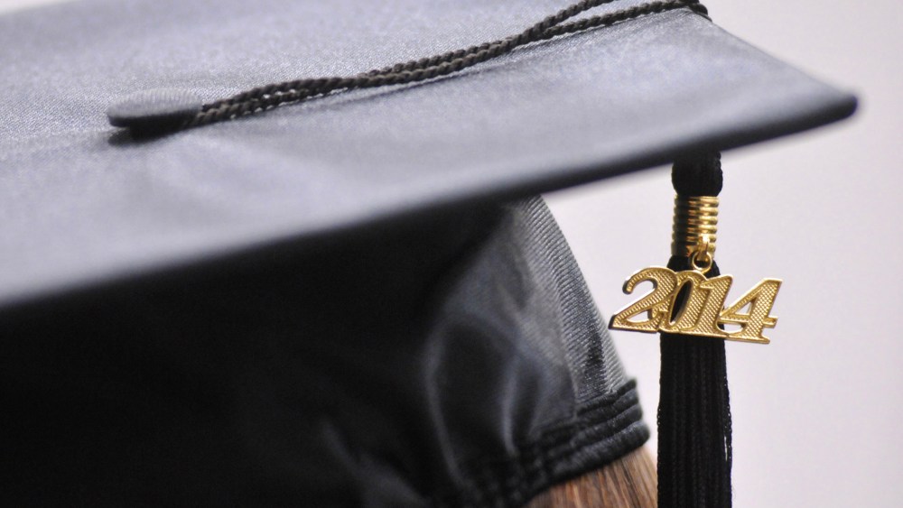 Tassels hang from a cap during commencement exercises on May 9, 2014.