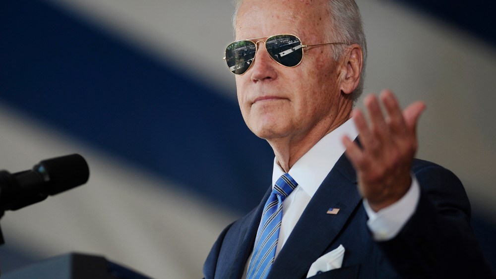 Vice President Joe Biden gestures after donning a pair of sunglasses as he delivers the Class Day Address at Yale University on May 17, 2015, in New Haven, Conn. (Photo by Jessica Hill/AP)