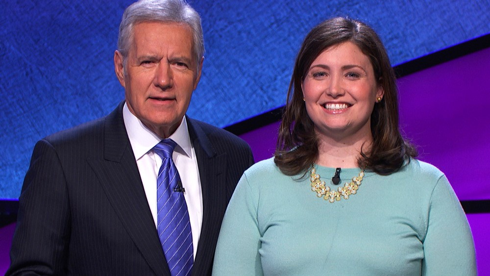 Alex Trebek poses with "Jeopardy!" contestant Julia Collins, January 2014.