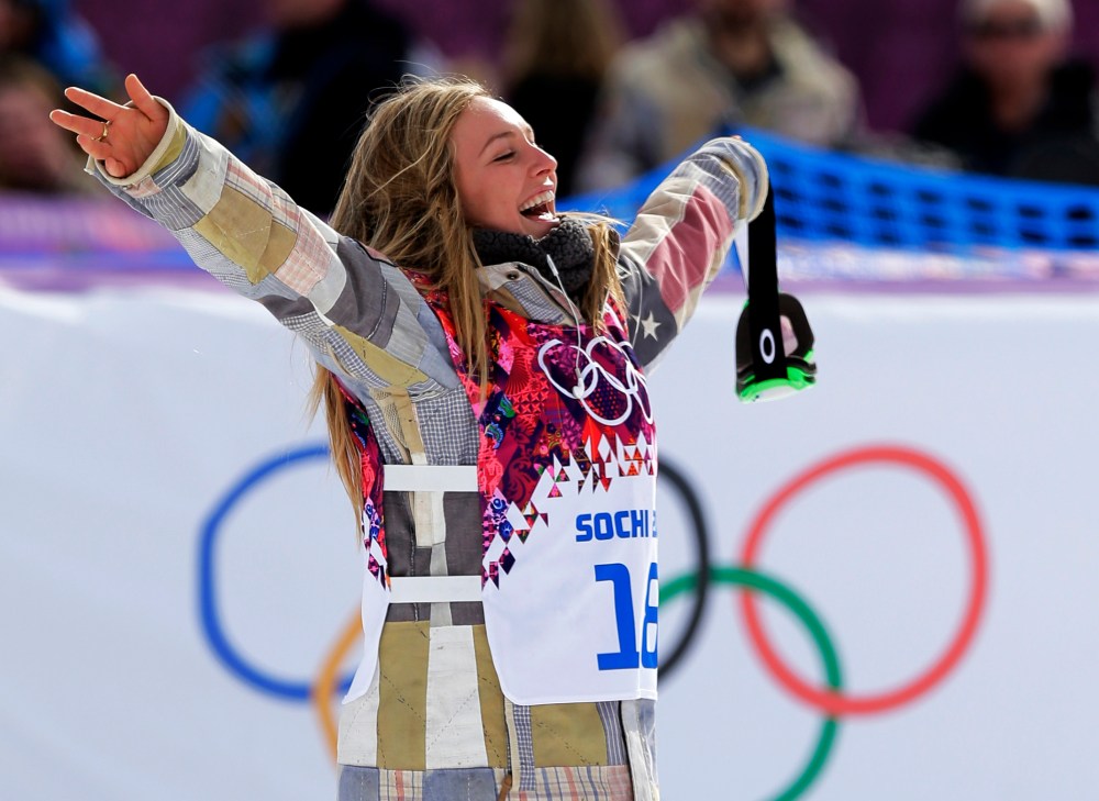 American Jamie Anderson celebrates after winning the women's snowboard slopestyle final at the 2014 Winter Olympics, Feb. 9, 2014, in Krasnaya Polyana, Russia.