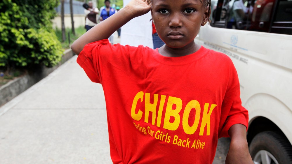 A girl attends a demonstration calling on the government to rescue kidnapped girls from a Chibok secondary school, during a workers day celebration in Lagos, Nigeria, May, 1. 2014.