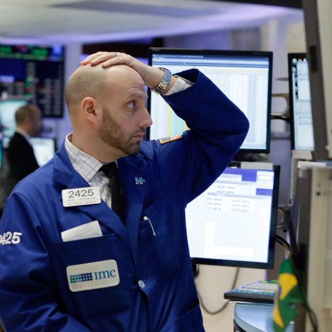 Specialist Meric Greenbaum works on the floor of the New York Stock Exchange, Jan. 4, 2016. U.S. stocks are opening 2016 on a grim note, dropping sharply after a plunge in China and declines in Europe. (Photo by Richard Drew/AP)