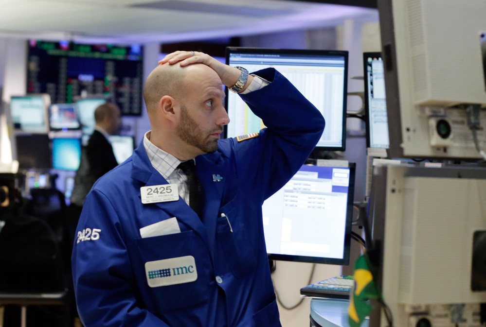 Specialist Meric Greenbaum works on the floor of the New York Stock Exchange, Jan. 4, 2016. U.S. stocks are opening 2016 on a grim note, dropping sharply after a plunge in China and declines in Europe. (Photo by Richard Drew/AP)