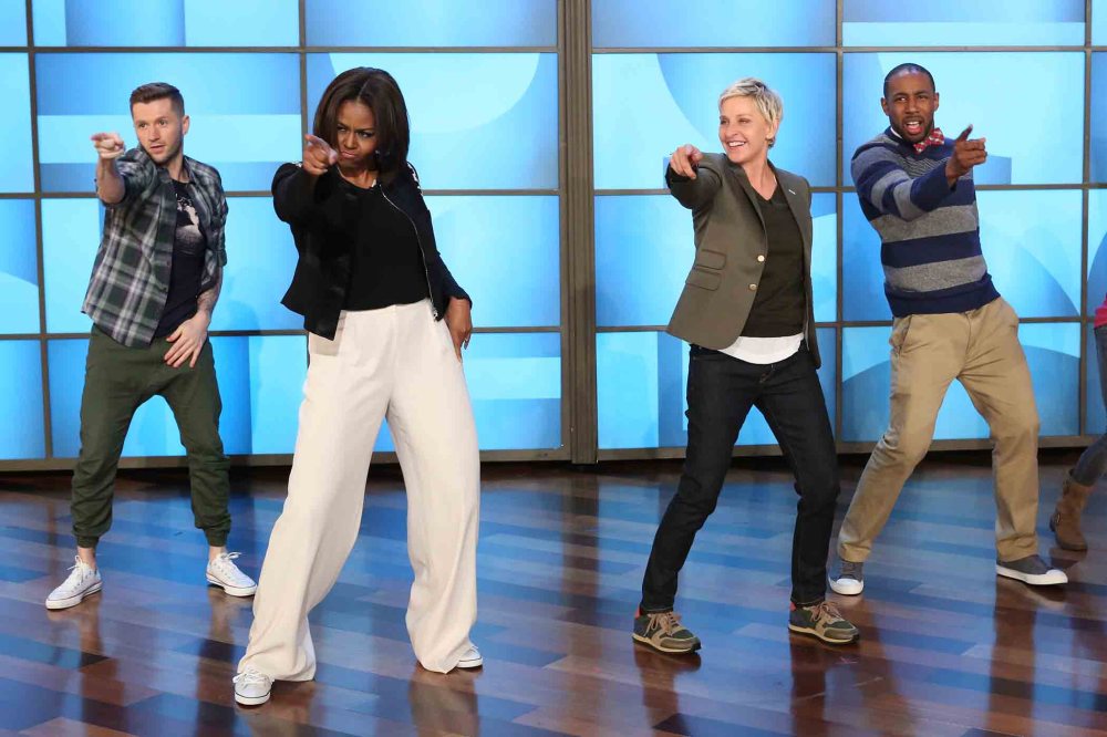 n this photo released by Warner Bros., talk show host Ellen DeGeneres, second right, dances with first lady Michelle Obama's as she takes part in Obama's #GimmeFive Challenge. (Photo by Mike Rozman/Warner Bros./AP)