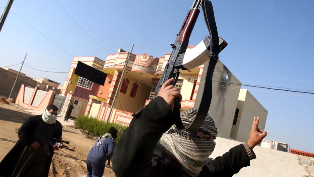 Gunmen patrol in Fallujah Iraq, Thursday, Jan. 9, 2014.
