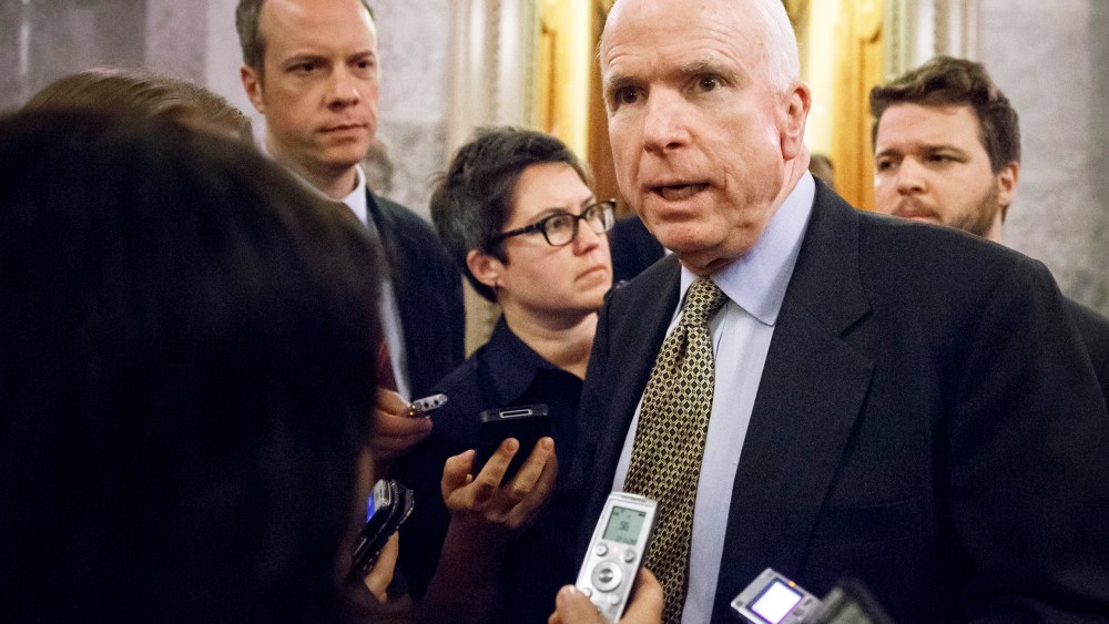 Sen. John McCain, R-Ariz., speaks to reporters as he leaves the Senate chamber after a roll call vote, at the Capitol in Washington, Nov. 12, 2014.