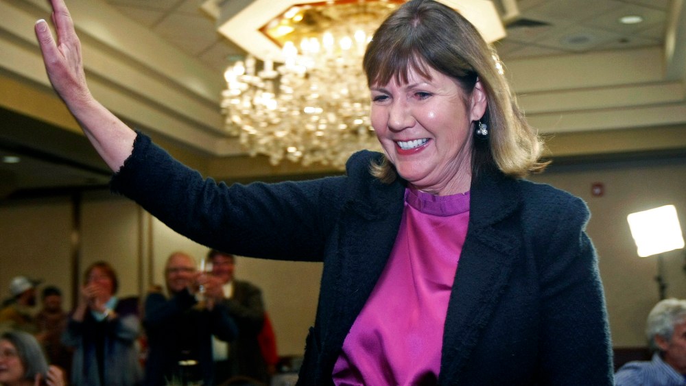 Ann Kirkpatrick waves as she enters a room full of supporters during an election night in Flagstaff, Ariz., Nov. 6, 2012.