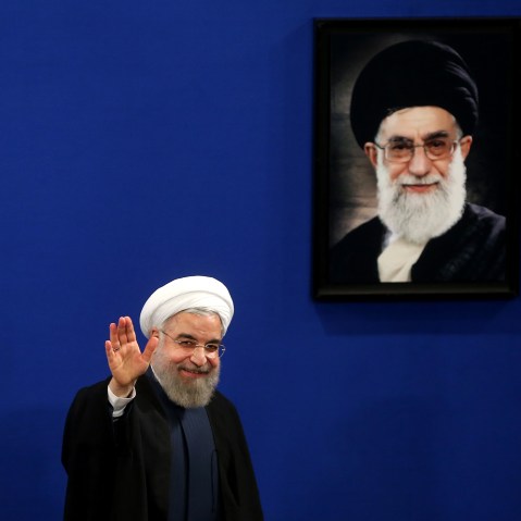 Iran's President Hassan Rouhani waves to reporters at the conclusion of his press conference in Tehran, Iran, Aug. 29, 2015. (Photo by Ebrahim Noroozi/AP)