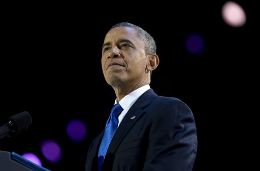 resident Barack Obama pauses as he speaks at the election night party at McCormick Place, Wednesday in Chicago. Obama defeated Republican challenger former Massachusetts Gov. Mitt Romney. (AP Photo/Carolyn Kaster)