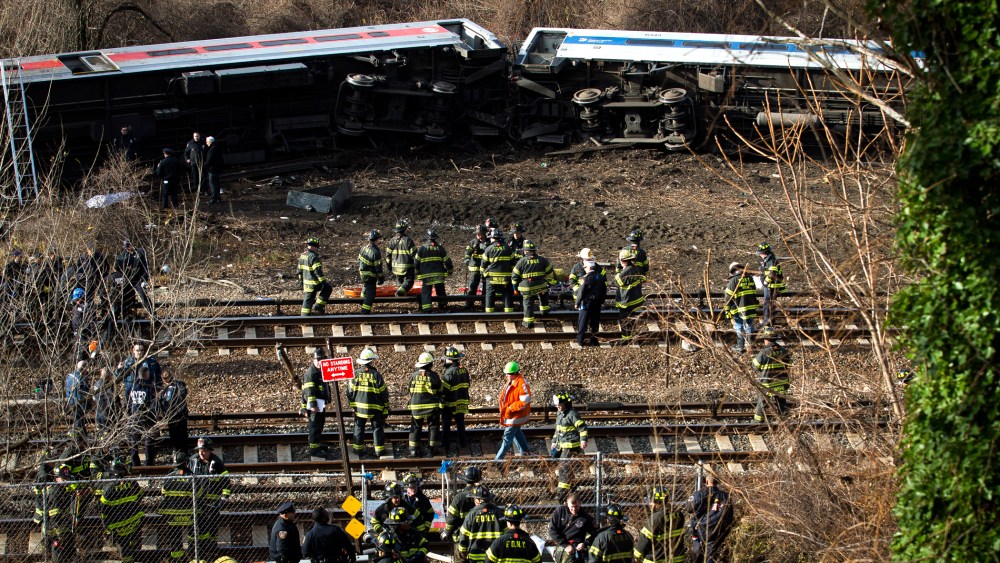 Emergency personnel respond to the scene of a Metro-North passenger train derailment in the Bronx borough of New York on Dec. 1, 2013.