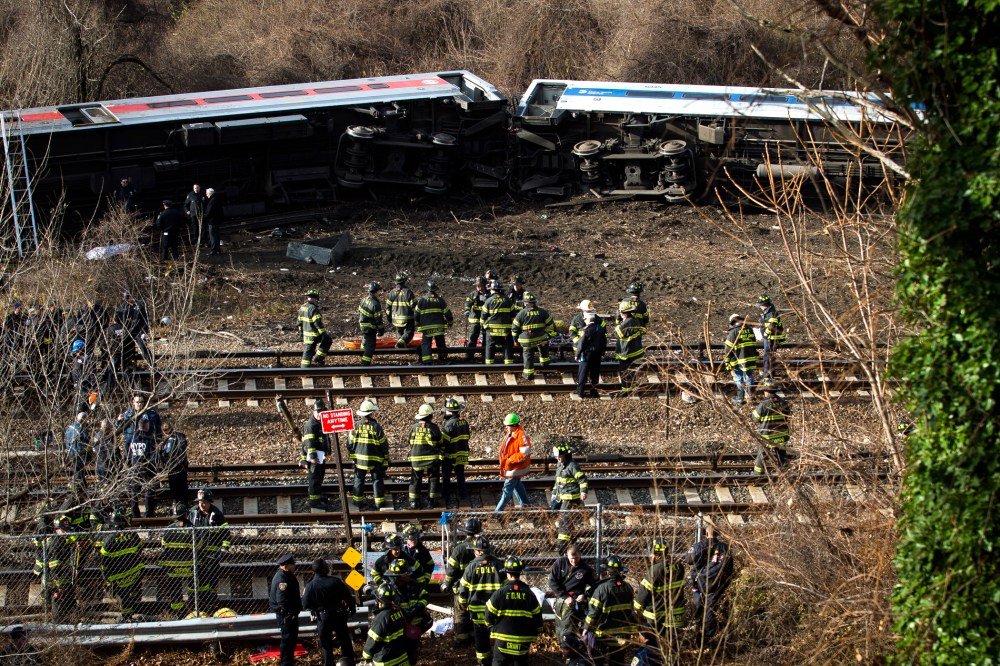 Emergency personnel respond to the scene of a Metro-North passenger train derailment in the Bronx borough of New York on Dec. 1, 2013.