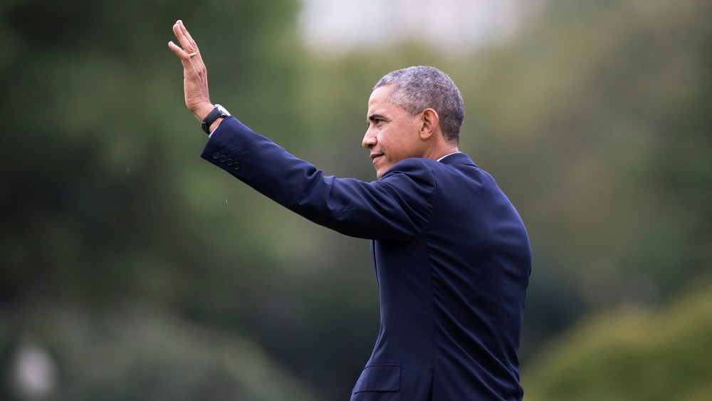 President Barack Obama waves as he walks across the South Lawn of the White House in Washington on Oct. 7, 2014. (Carolyn Kaster/AP)