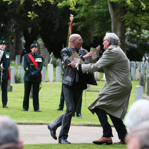 Canadian Ambassador to Ireland Kevin Vickers wrestles with a protester during a State ceremony to remember the British soldiers who died during the Easter Rising in Dublin, May 26, 2016. (Photo by Brian Lawless/PA Wire/AP)